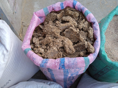 Nutritious Cattle Feed Stored in Colorful Sacks, Essential for Dairy Farming and Livestock Health, Supporting Sustainable Milk Production and Agricultural Developmentの写真素材