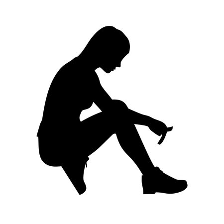 Vector silhouette of a woman sitting on the floor on a white background.のイラスト素材