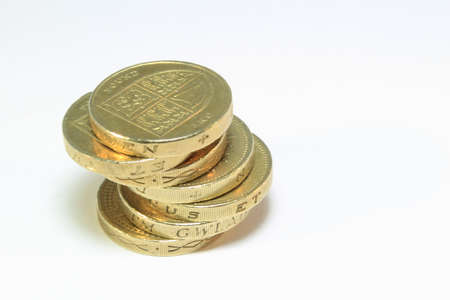An uneven stack of British one Pound coins
