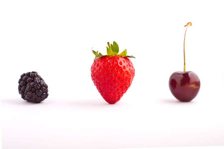 Berries lined up on an isolated white backgoundの写真素材