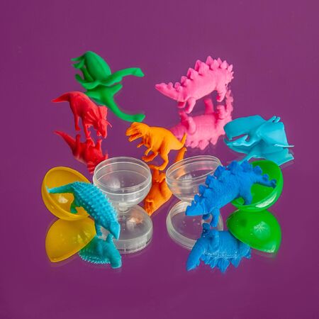 Dinosaur toy on colored background, Minaiture dinosaur model.の写真素材