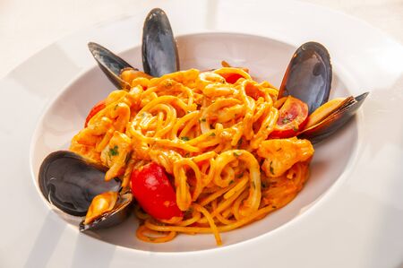 Pasta with oysters on a plateの写真素材