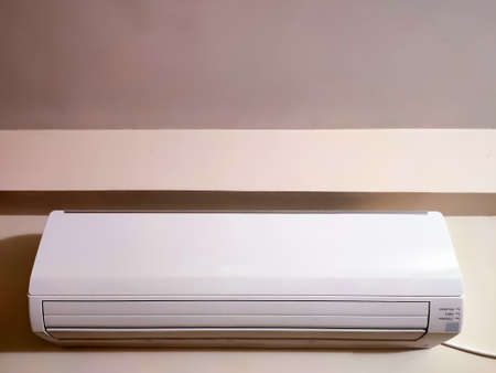 Split air conditioner on a white wall. Closeup image.の写真素材