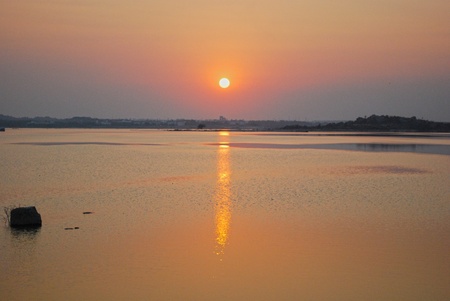 Beautiful Golden sunset in lakeの写真素材