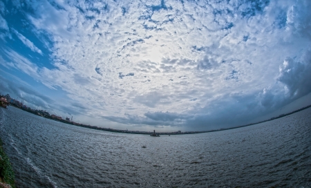 Fish-eyeof Hussain Sagar Lake with effects of globe and earthの写真素材