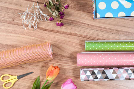 florist desktop with working tools and materialsの写真素材