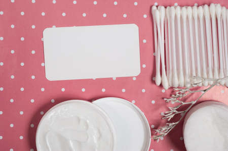 facials skin care. cotton pads and buds on the pink backgroungの写真素材
