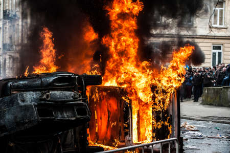 car destroyed and set on fire during the riots. city centerの写真素材