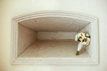 nice wedding bouquet in a stone niche in a wallの写真素材
