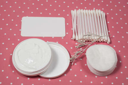 facials skin care. cotton pads and buds on the pink backgroungの写真素材