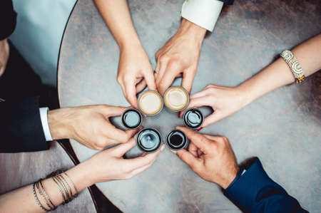 friends toasting with a liqueur shotsの写真素材