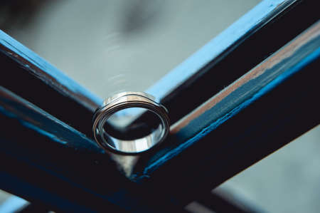 Wedding rings of gold. Ring in ring in a blue windowの写真素材