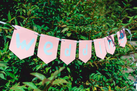 wedding flags and bushes in a backの写真素材