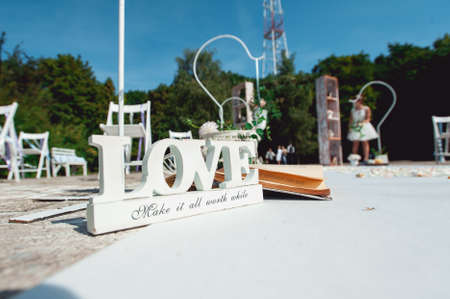 Retro wedding ceremony outdoors. wedding arch. love sunny dayの写真素材