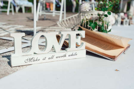 Retro wedding ceremony outdoors. wedding arch. love sunny dayの写真素材