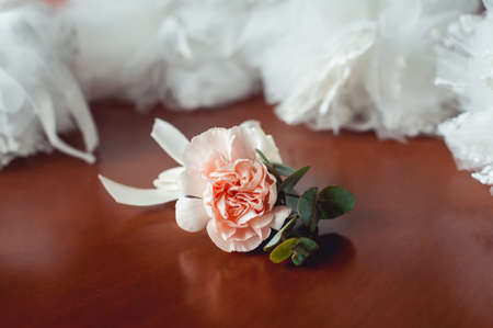 fiances wedding buttonhole made of beige rose