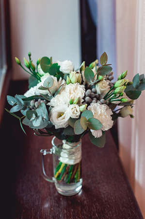 luxury bridal bouquet made of red roses and peonyの写真素材