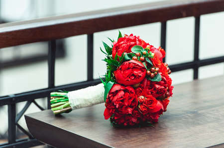luxury bridal bouquet made of red roses and peonyの写真素材