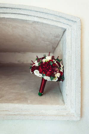 wedding bouquet in a stone nicheの写真素材