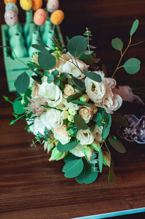 wedding bouquet decorated with a black ribbon made of rosesの写真素材