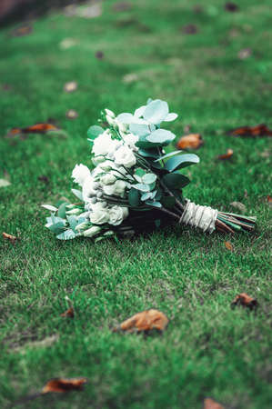 luxury bridal bouquet made of white roses and carnationの写真素材