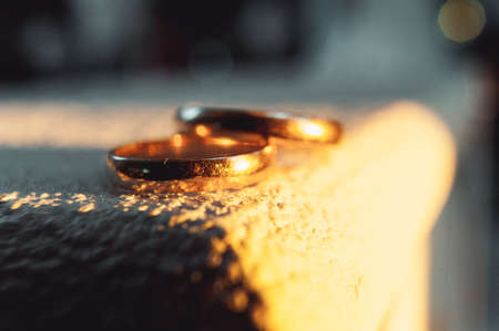 classic gold wedding rings on a white backgroundの写真素材