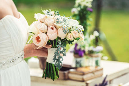 wedding bouquet of white and biege rosesの写真素材