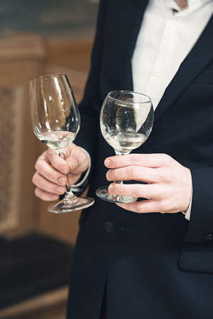 people consider the color of the wine and try how it smells in different glassesの写真素材