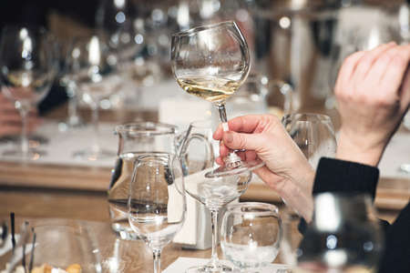 people consider the color of the wine and try how it smells in different glassesの写真素材