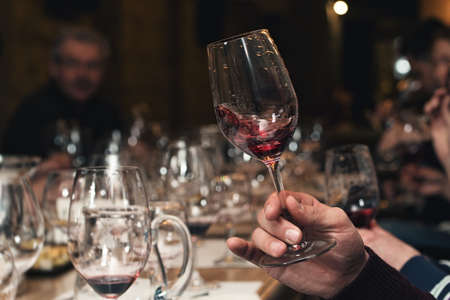 people consider the color of the wine and try how it smells in different glasses