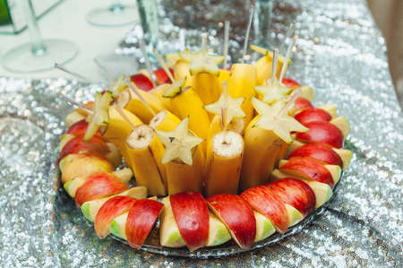 plate with bananas and applesの写真素材