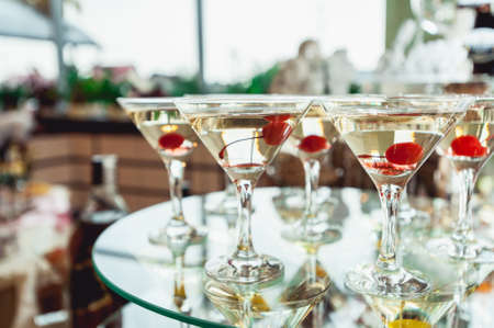 Cold alcoholic margareta cocktail. Glass with drink stands on the glass standの写真素材