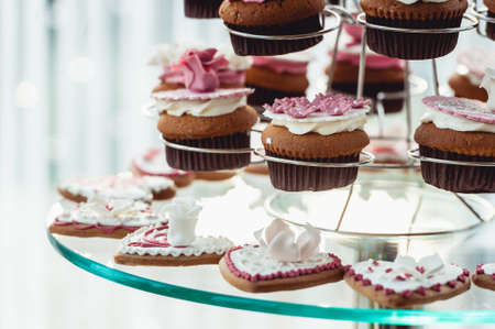 Cute candy bar with various candies and cakes. Wedding candybarの写真素材