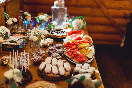 Candy Bar. Delicious sweet buffet with different sweet. Table with desserts and fruitsの写真素材