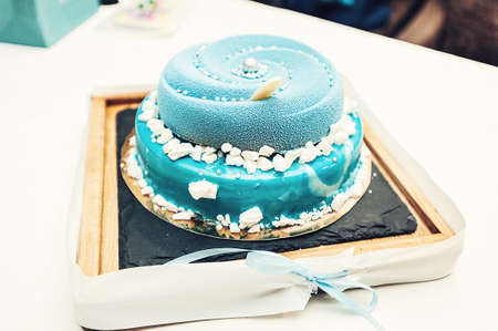 wedding blue cake with mini balls on a deskの写真素材