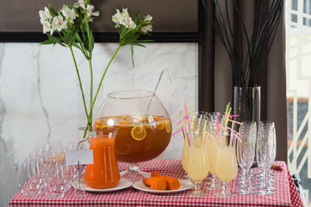 Fresh juice on a table in a restaurant. Healthy drinks. carrot fresh in a jarの写真素材