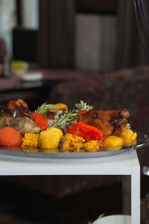 roasted suckling pig with vegetablesの写真素材