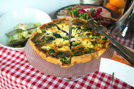 Traditional greek spinach pie, spanakopita, with goat cheese. Brunch in a restaurantの写真素材