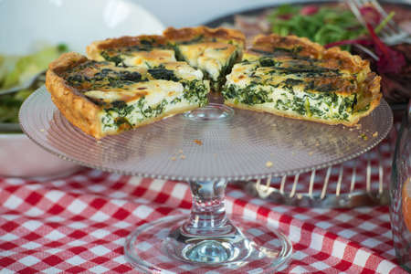 Traditional greek spinach pie, spanakopita, with goat cheese. Brunch in a restaurantの写真素材