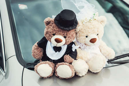 small plush bears on a wedding. Decoration on the car hoodの写真素材