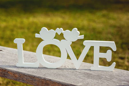 white Love letters on a wooden board. outsideの写真素材