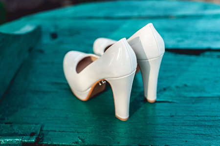 brides biege shoes on heel on a wooden board tiffany colourの写真素材