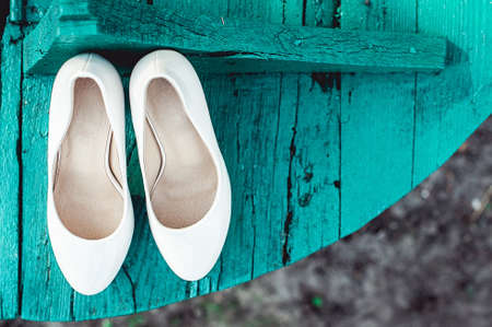 brides biege shoes on heel on a wooden board tiffany colourの写真素材