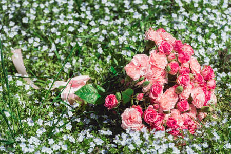 wedding bouquets of biege carnations and pink roses