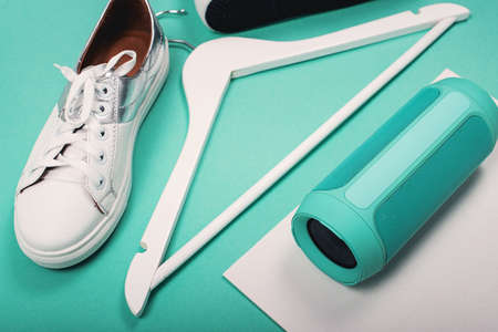 Flat Lay of Modern White Shoes. Overhead Top View Photography. Youth Lifestyle Concept. Turquoise...
