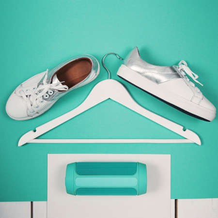 Flat Lay of Modern White Shoes. Overhead Top View Photography. Youth Lifestyle Concept. Turquoise...