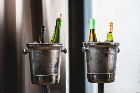 Two Bottles of Wine in ice bucket in a restaurant. at the food and wine pairing eveningの写真素材