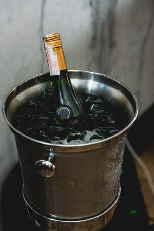 Bottle of Wine in ice bucket in a restaurant. at the food and wine pairing eveningの写真素材