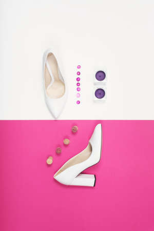 Shoes fashion. Stylish Trendy white heels on a pink background. Summer fashion Outfit, Luxury Party shoes. Minimal fashion concept.の写真素材
