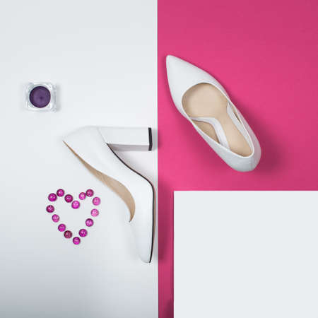 Shoes fashion. Stylish Trendy white heels on a pink background. Summer fashion Outfit, Luxury Party shoes. Minimal fashion concept.の写真素材
